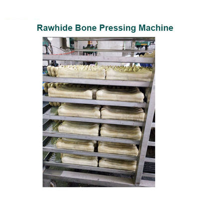 Hueso de la comida de perro que hace la máquina