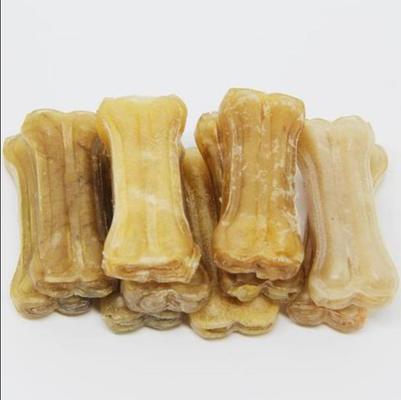 el perro de 15 pulgadas que masticaba los bocados presionó los huesos del cuero crudo de la máquina que hacían la máquina